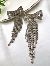 Load image into Gallery viewer, Shiny bow earrings with tassel
