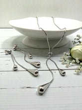 Load image into Gallery viewer, Tie jewelry set with teardrop shapes at the ends
