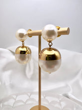 Load image into Gallery viewer, Pearl with open gold shell earrings
