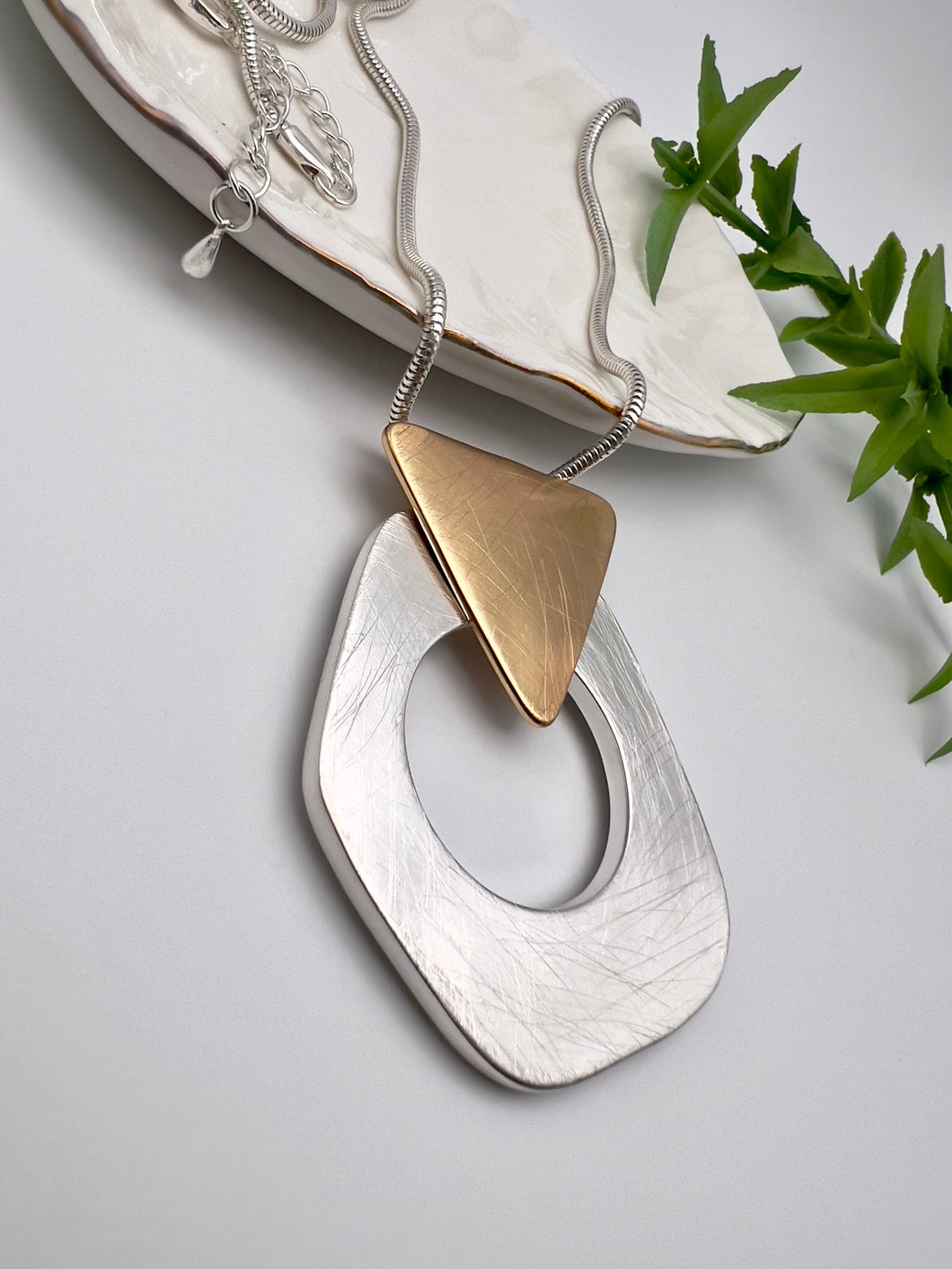 Brushed silver and gold detail long necklace