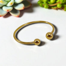 Load image into Gallery viewer, Open bracelet with spheres at the ends
