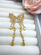 Load image into Gallery viewer, Long butterfly earrings side style.
