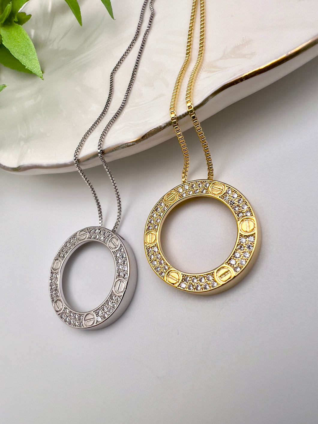 Studded nail cartie pendant necklace