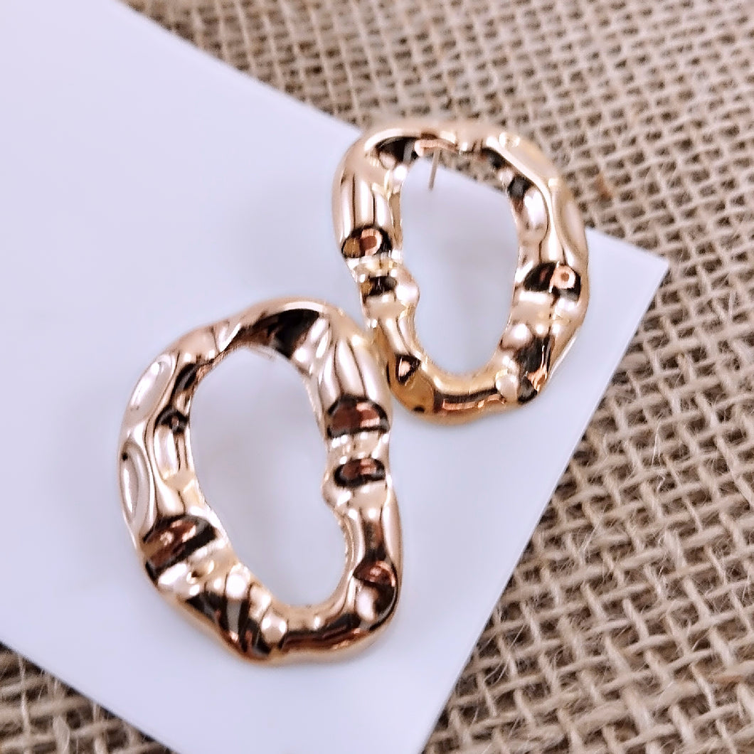 Organic crumpled oval hollow earring