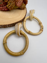 Load image into Gallery viewer, Marbled base and bamboo circle earrings
