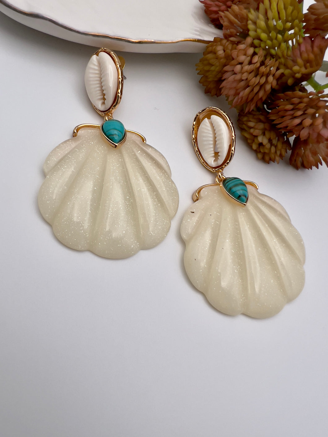 Whelk base and shell pendant earring